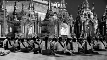 Buddhist People Sitting In Front Of The Shwedagon In Yangon, Myanmar