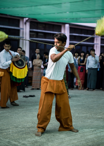 Man Shows His Burmese Dance During Htamane Contest At Yangon University Of Foreign Languages, Myanmar