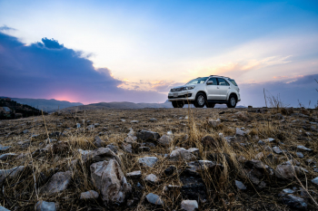 White Toyota Fortuner At Dukan Lake In Iraq While A Storm Is Rising