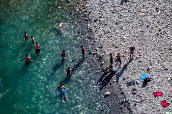 People Are Playing In Crystal Blue Water In Eastern Turkey